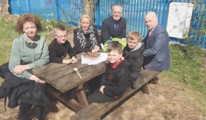 CAPACTIVE LEARNING: Culture Minister Carál Ní Chuilín and Gerry Kelly from Sinn Féin with classroom assistant Sharon Cairns, pupils Shea Maguire, Ryan O'Neill and Caiden Stewart and Principal Kevin McArevey at Holy Cross Boys School