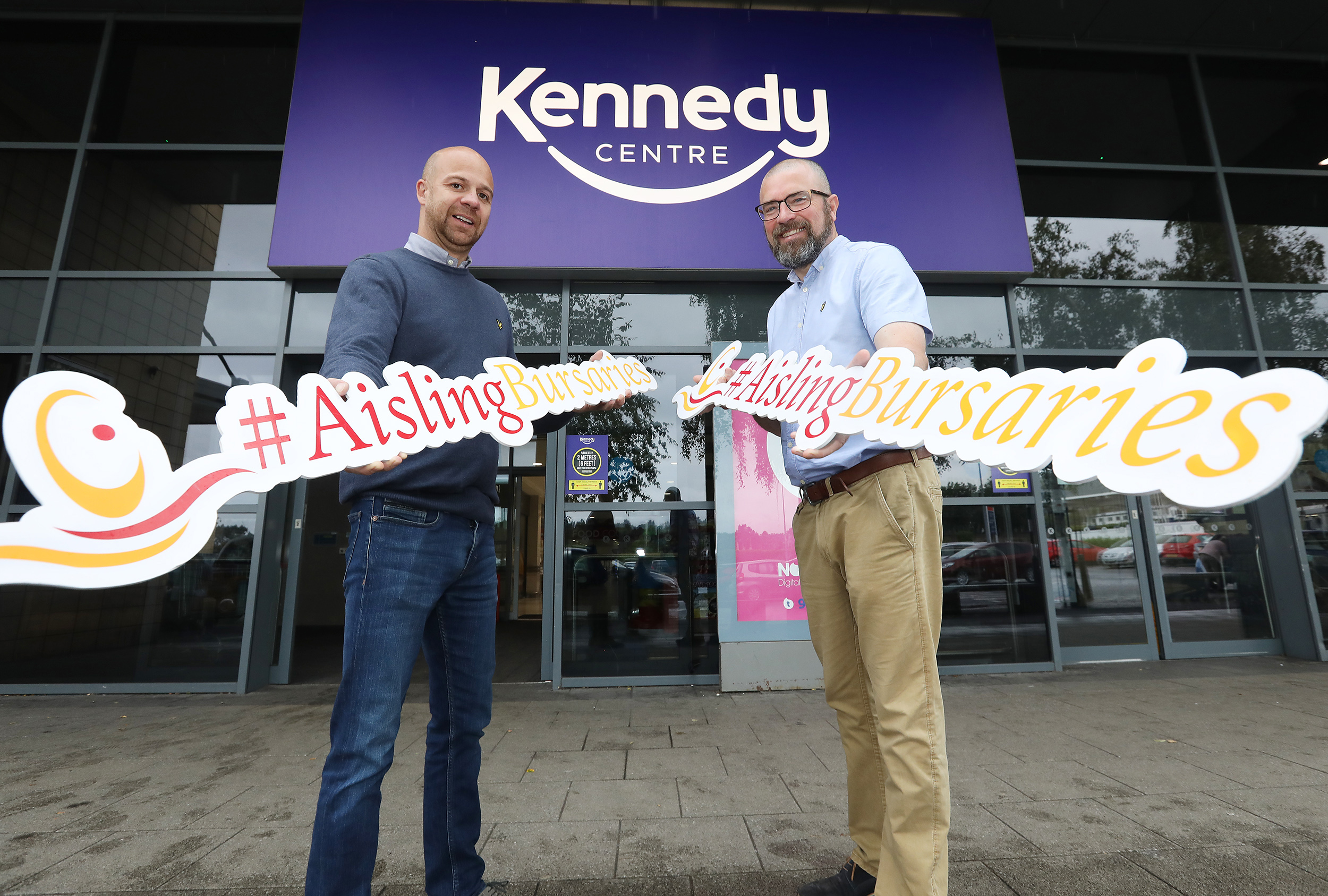 STEPPING UP: John Jone of the Kennedy Centre pledges support for Aisling Bursaries to Hugh Duffy of the West Belfast Partnership Board.